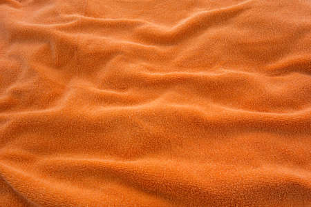 Texture of an orange bath towel の写真素材
