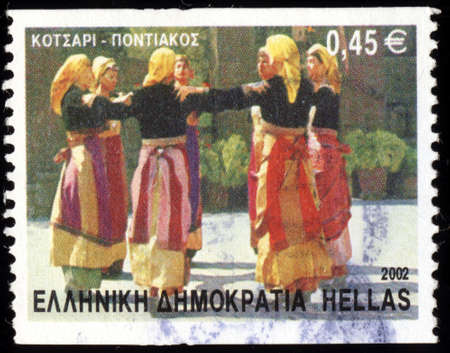 GREECE - CIRCA 2002: A postage stamp printed in the Greece shows Greek national folk Kotsari - pontiak dance, circa 2002

の写真素材