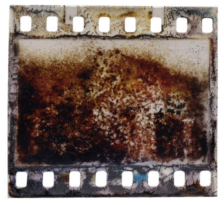 Old scratched and damaged grungy negative filmstripの写真素材