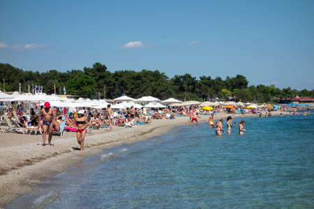 ALEXANDROUPOLIS, GREECE - JULY 03: People sunbathing on the beach on July 03, 2014 in Agia Paraskevi, Makri, Greece. Tourist destination with clear seaのeditorial素材