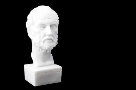 Greek philosopher Democritus (460â370 B.C.E.) sculpture isolated on black backgroundの写真素材