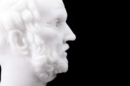 Greek philosopher Democritus (460â370 B.C.E.) sculpture isolated on black backgroundの写真素材