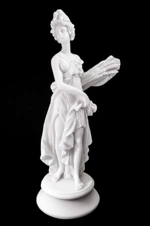 Demeter is the goddess of the harvest, who presided over grains and the fertility of the earth. Isolated on black backgroundの写真素材