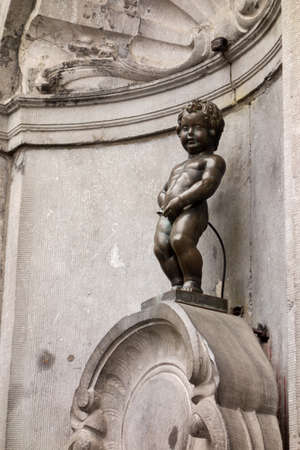 BRUXELLES, BELGIUM - JULY 24, 2014: Manneken pis ( Little Man Pee or le Petit Julien) is an iconic town symbolのeditorial素材