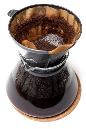 Filter coffee into a glass jugの写真素材