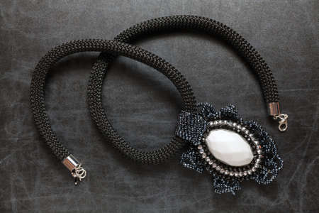 Handcrafted necklace constructed by various beadsの写真素材