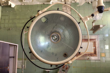 Interior of an abandoned building with rubble and debris. Deserted old hospitalの写真素材