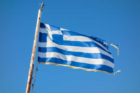 Greek flags waving against the blue skyの写真素材