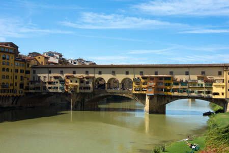 FLORENCE, ITALY - SEPTEMBER 23, 2014: Ponte Vecchio in Florence, Italy on 23 September. It is a Medieval stone arch bridge over the Arno River noted for still having shops built along it.のeditorial素材