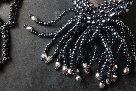 Jewelry made from beads. Bead Necklace on a dark surface.の写真素材