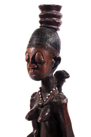 African wooden figure against white backgroundのeditorial素材