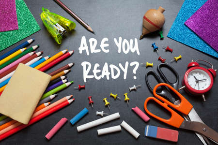 Are you ready?. School tools around. Blackboard background.の写真素材