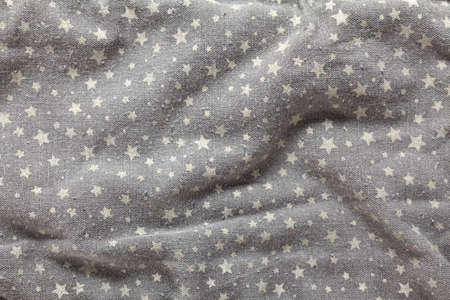 Detail of gray fabric cotton, decorated with stars