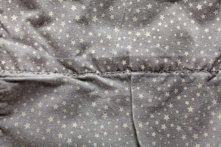 Detail of gray fabric cotton, decorated with stars