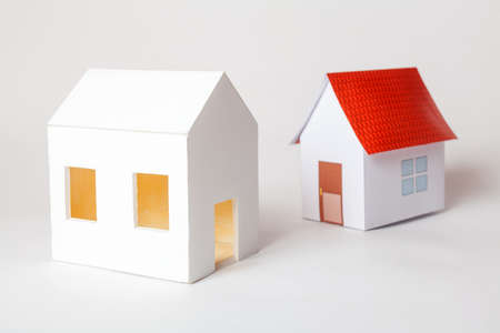 Papercraft House. Small houses from paper on white background. Quality of life concept.の写真素材