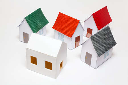 Papercraft House. Small houses from paper on white background. Quality of life concept.の写真素材