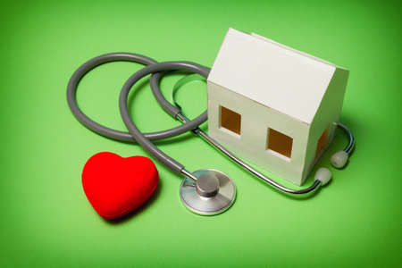 Requirements of the house. Paper house with stethoscope that indicates the health of the house.の写真素材