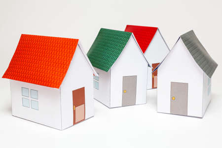 Papercraft House. Small houses from paper on white background. Quality of life concept.の写真素材