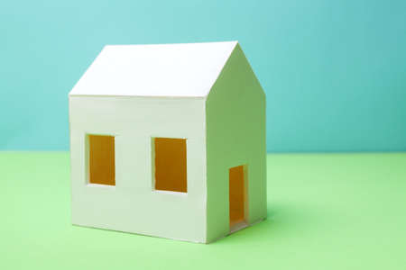 Papercraft House. Small house from paper. Quality of life concept.の写真素材