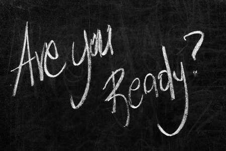 Written are you ready? on the blackboard with white chalkの写真素材