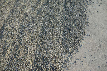 Pile of green gravel - sand, ready to be used as a construction materialの写真素材