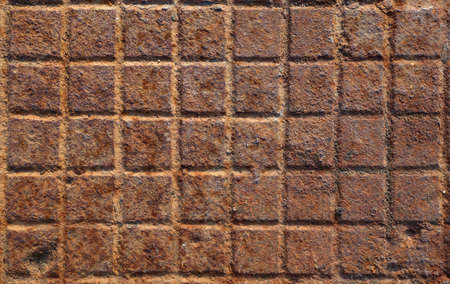 Detail of the pattern from a rusty manhole coverの写真素材