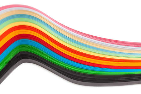 Paper strips in rainbow colors as a colorful backdrop on whiteの写真素材
