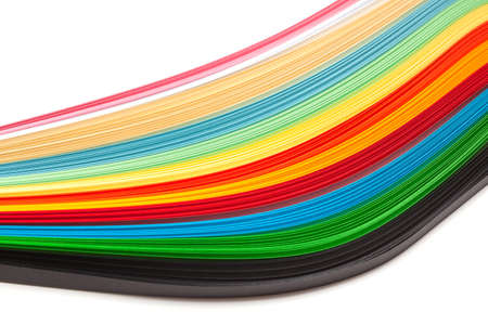 Paper strips in rainbow colors as a colorful backdrop on whiteの写真素材