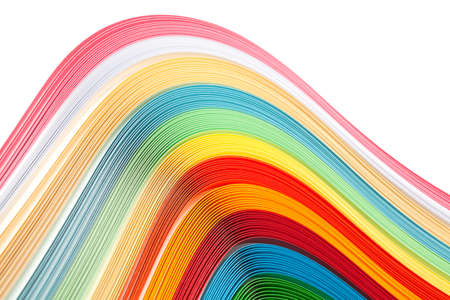 Paper strips in rainbow colors as a colorful backdrop on whiteの写真素材