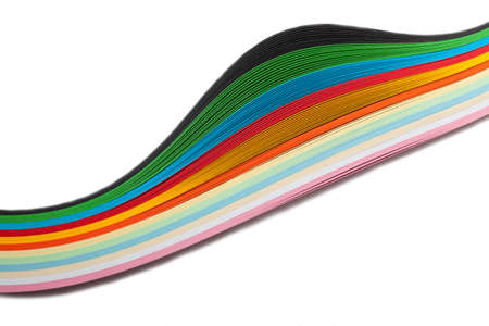Paper strips in rainbow colors as a colorful backdrop on whiteの写真素材