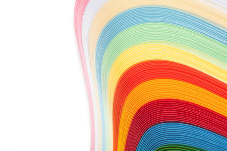 Paper strips in rainbow colors as a colorful backdrop on whiteの写真素材