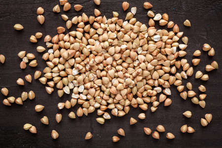 Buckwheat groats on a wooden table