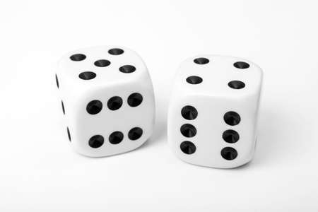 Two white dice isolated on whiteの写真素材