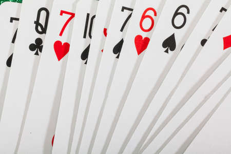 Different playing cards on white background