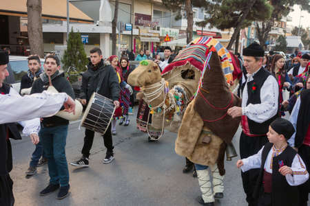 ALEXANDROUPOLIS, GREECE - DEC 31, 2015: Revival of the custom of camel by the Cultural Educational Association of Eastern Rumelia Ebrou around the Town Hall in the city centerのeditorial素材