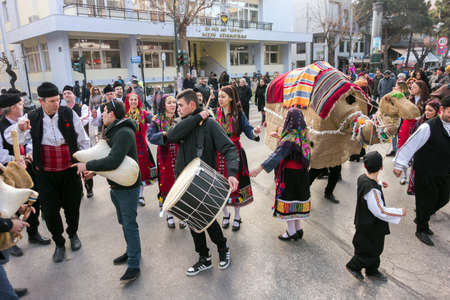 ALEXANDROUPOLIS, GREECE - DEC 31, 2015: Revival of the custom of camel by the Cultural Educational Association of Eastern Rumelia Ebrou around the Town Hall in the city centerのeditorial素材