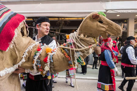 ALEXANDROUPOLIS, GREECE - DEC 31, 2015: Revival of the custom of camel by the Cultural Educational Association of Eastern Rumelia Ebrou around the Town Hall in the city centerのeditorial素材