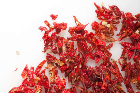 Red hot Trinidad moruga scorpion peppers chopped on white backgroundの写真素材