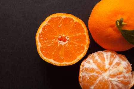 Tangerines on black backgroundの写真素材