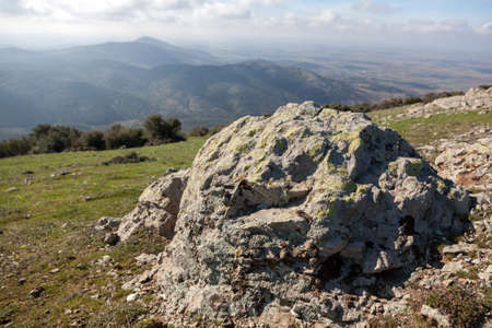 Greek landscape with meadow, rocks and mountain