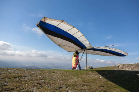 Hang glider prepares for take offの写真素材