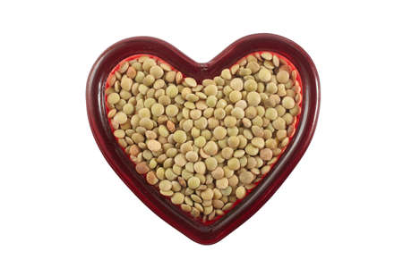 Lentils in the heart shape container with clipping pathの写真素材