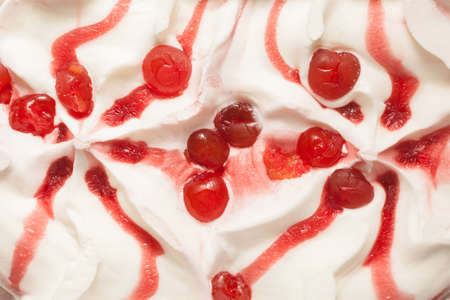 Vanilla ice cream with cherries and syrupの写真素材