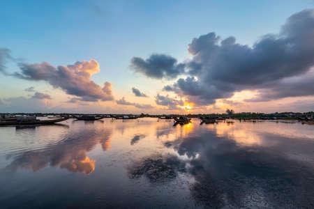 Boats in Tam Giang lagoon in sunrise in Hue, Vietnamの写真素材