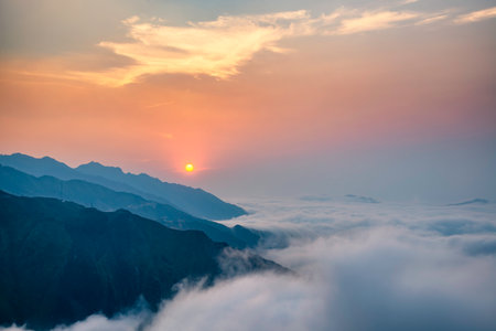 Ta Xua is a famous mountain range in northern Vietnam. All year round, the mountain rises above the clouds creating cloud inversions.の写真素材