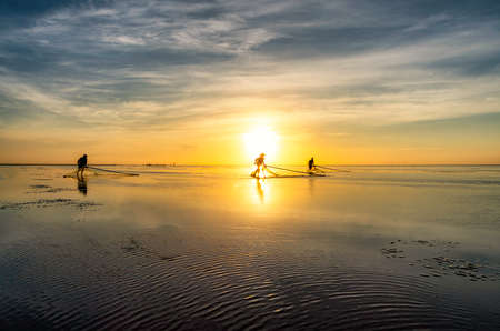 Shadow fishermen in the early morning.の写真素材