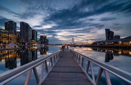 Buildings around the Dockland area of Melbourne illuminated at nightの写真素材