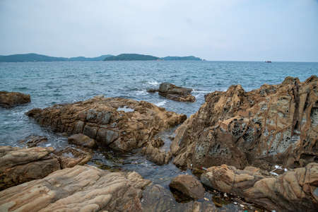 Sea cliff in Co To island of Co To district in Quang Ninh provice, Viet Nam Co To is a small rural district of Quang Ninh Province in the northeastern region of Vietnam. As of 2009 the district had a population of 4,985, is the lowest population district in Quang Ninh. The district covers an area of 47.3 kmÂ². The district capital lies at Co Toの写真素材