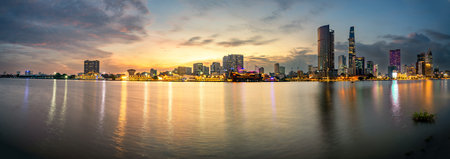 Cityscape of Ho Chi Minh at night with bright illumination of modern architecture, viewed over...
