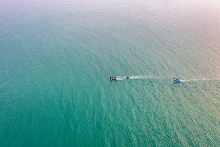 My Khe beach is a beautiful beach in Danang city , Vietnam. The sunrise is on creels , ( fishing boats in Vietnam ). My Khe Beach is in Top 6 beautiful beach in the World By Forbes Magazine.の写真素材
